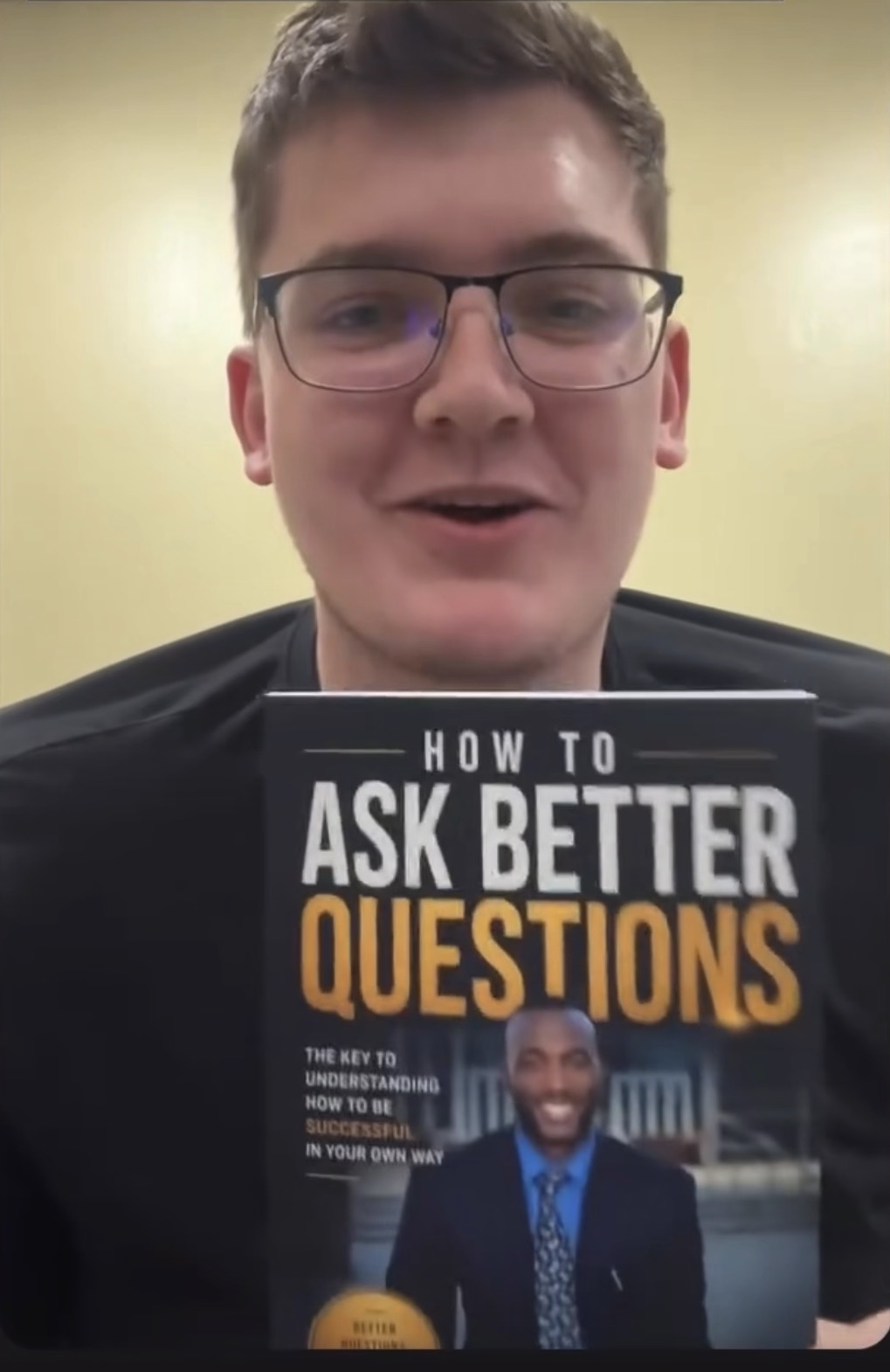 Reader 1 holding How to Ask Better Questions